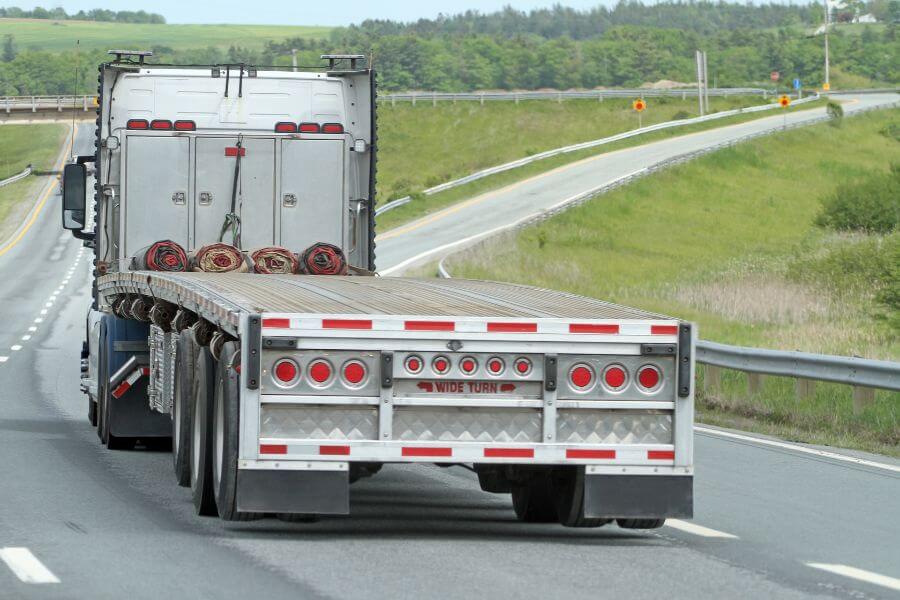 what is a flatbed trailer and what are the different types logos logistics